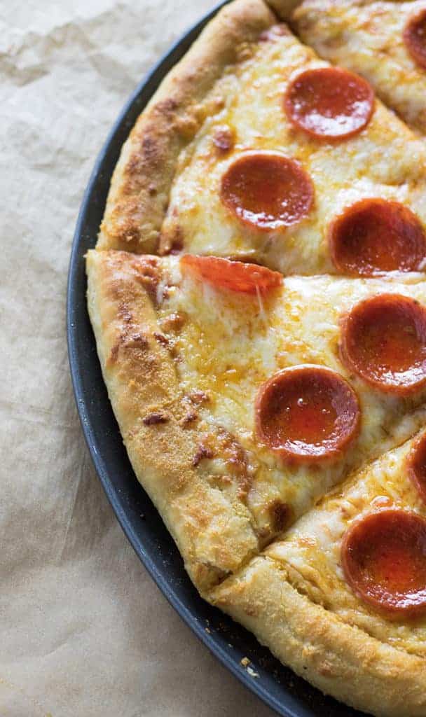 Adding butter to pizza dough