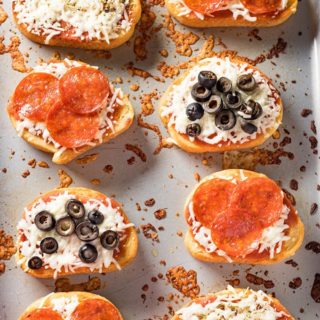 pizza toast made using frozen garlic bread with pizza sauce and toppings
