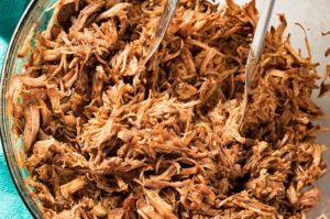 easy pulled pork recipe made in the instant pot with bbq sauce and pork loin