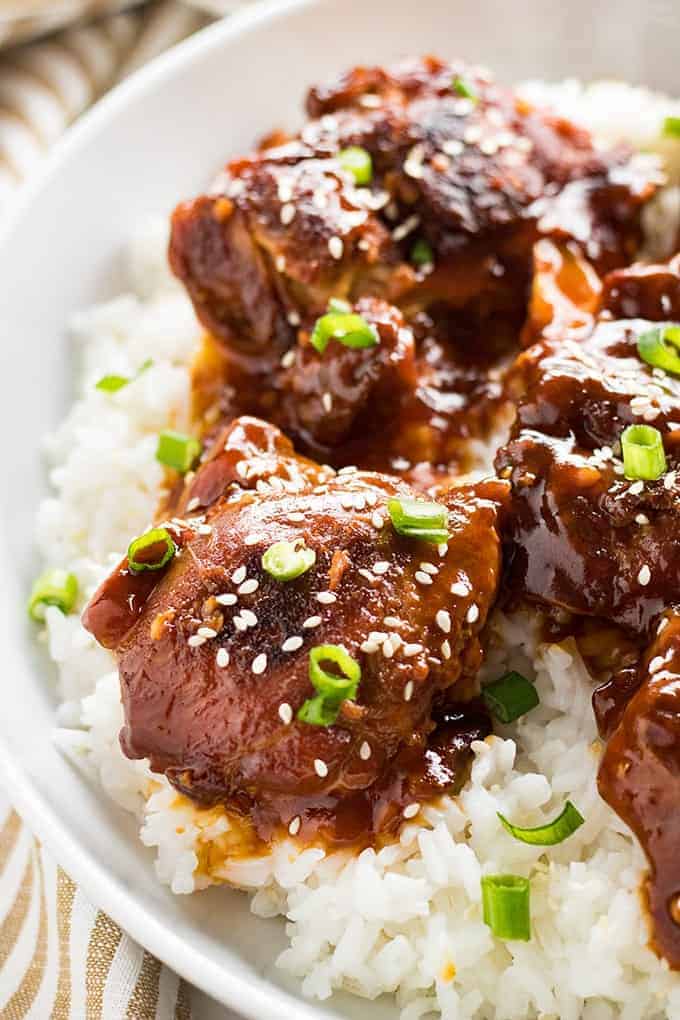 honey sesame instant pot chicken thighs served over rice