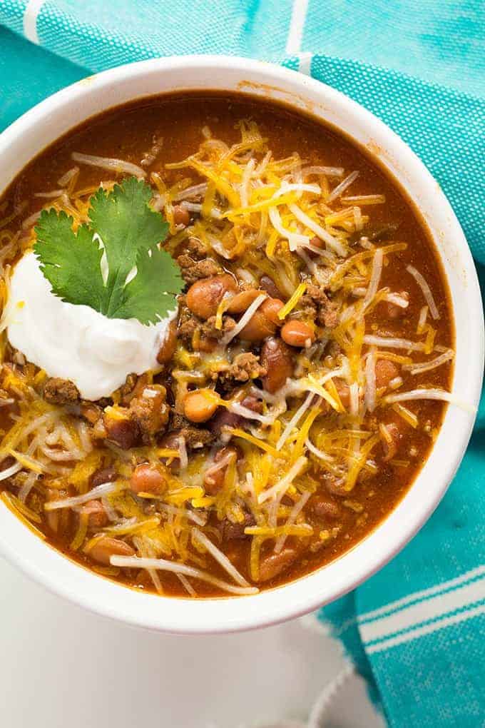 The best instant pot chili with beef and beans topped with cheese