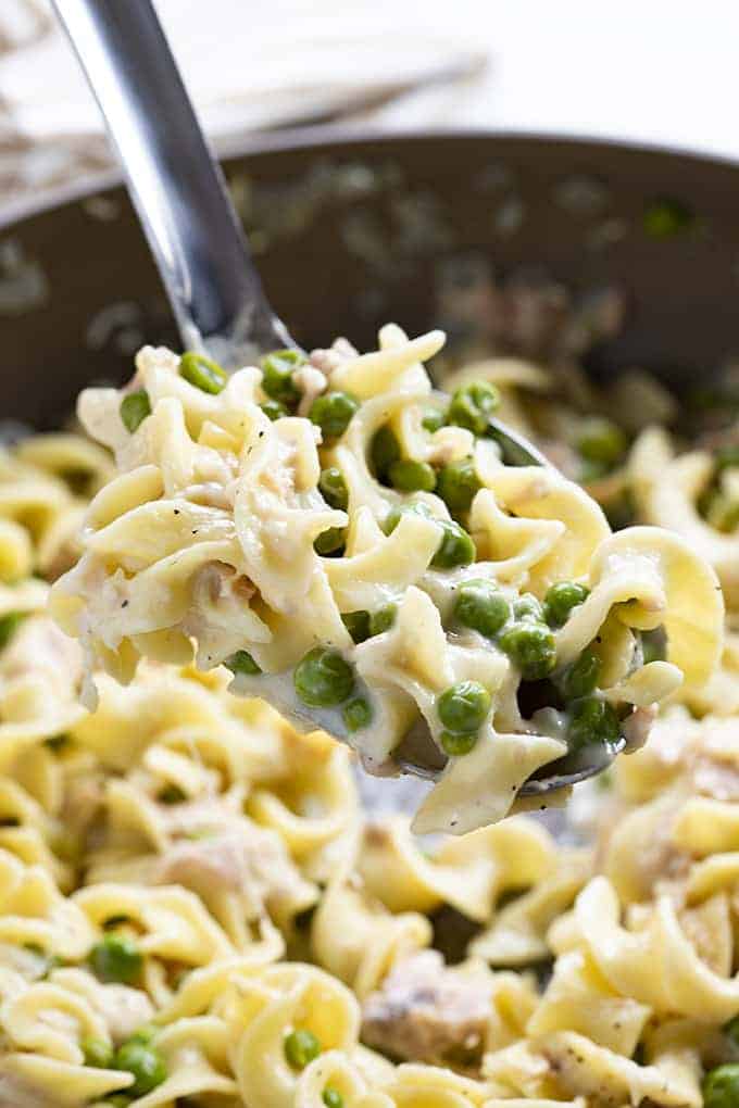 tuna pasta made in one pot with peas and parmesan cheese