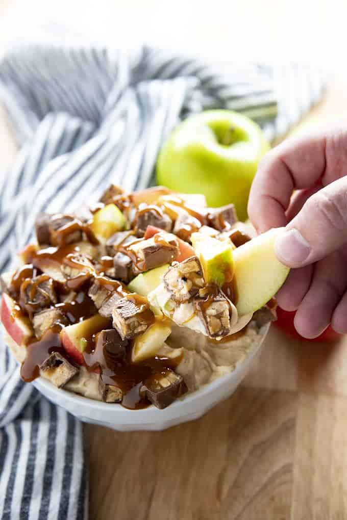 caramel apple snickers dip served with sliced apple