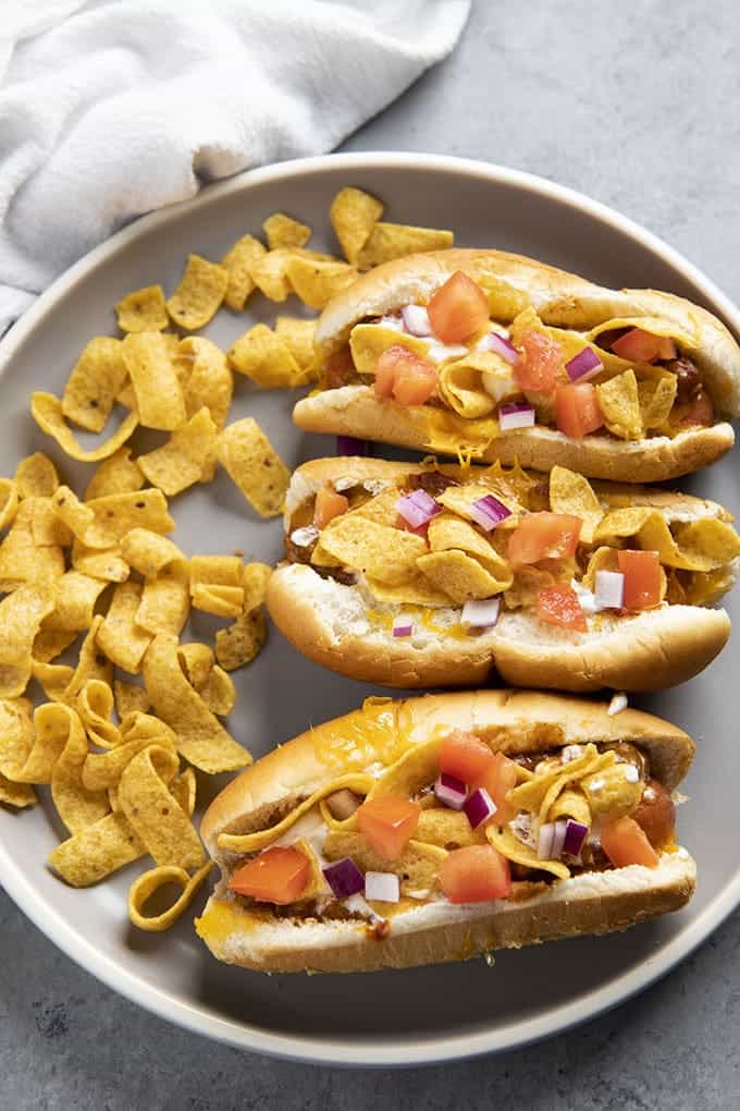 frito topped chili dogs on a plate
