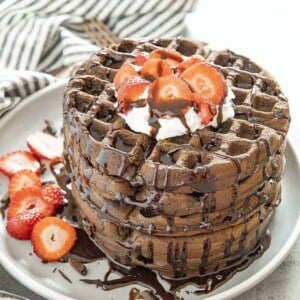 chocolate waffles stacked on a plate