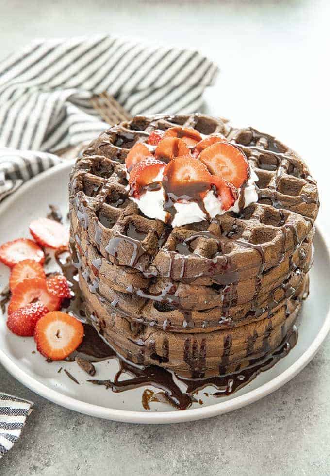 chocolate waffles stacked on a plate