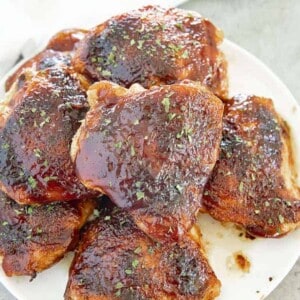 bbq baked chicken thighs on a plate