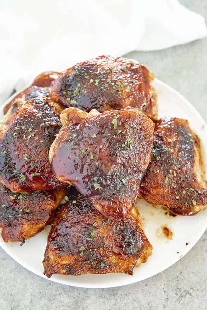bbq baked chicken thighs on a plate