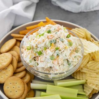 crab dip with crackers in a bowl