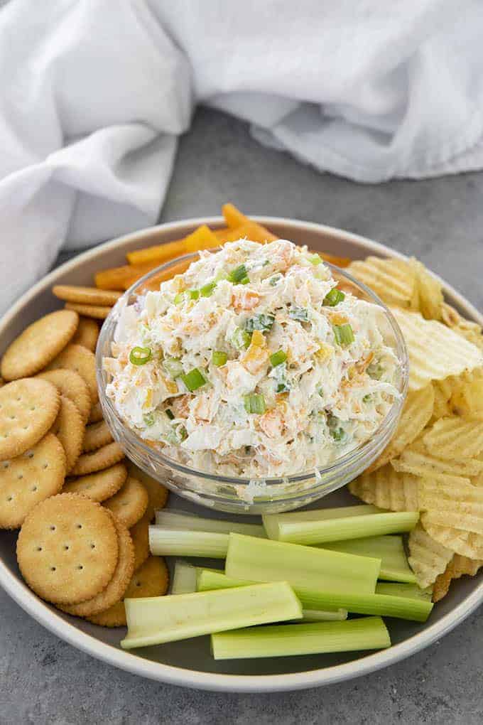 crab dip with crackers in a bowl