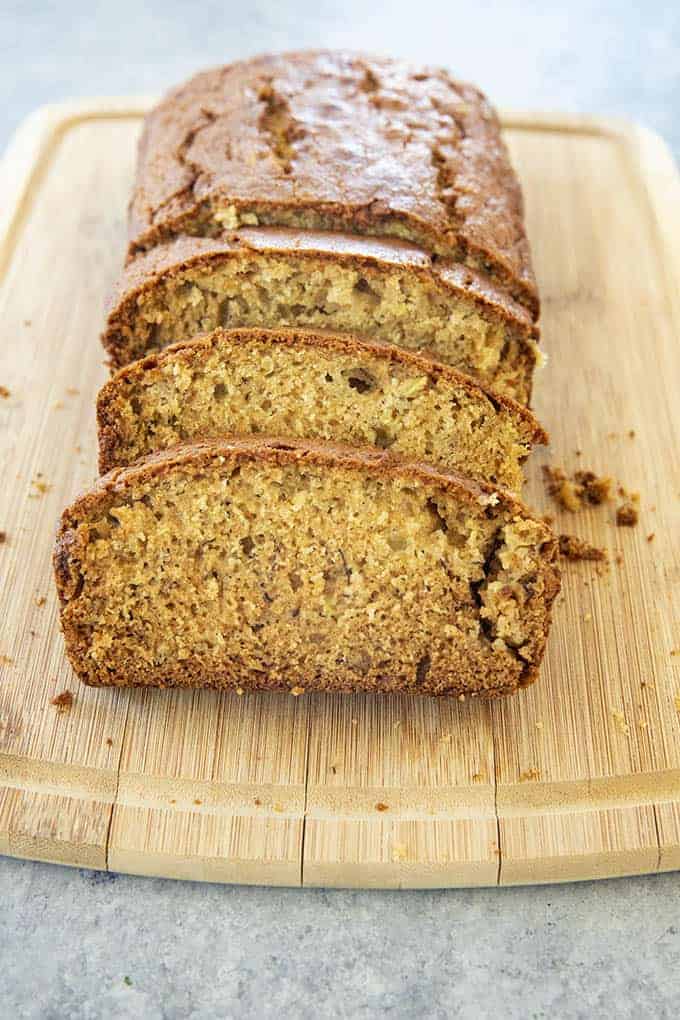 sliced zucchini bread on cutting board