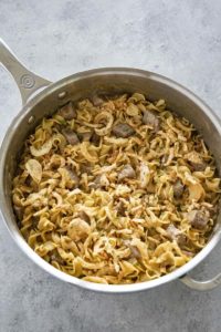 french onion beef and noodles in pan