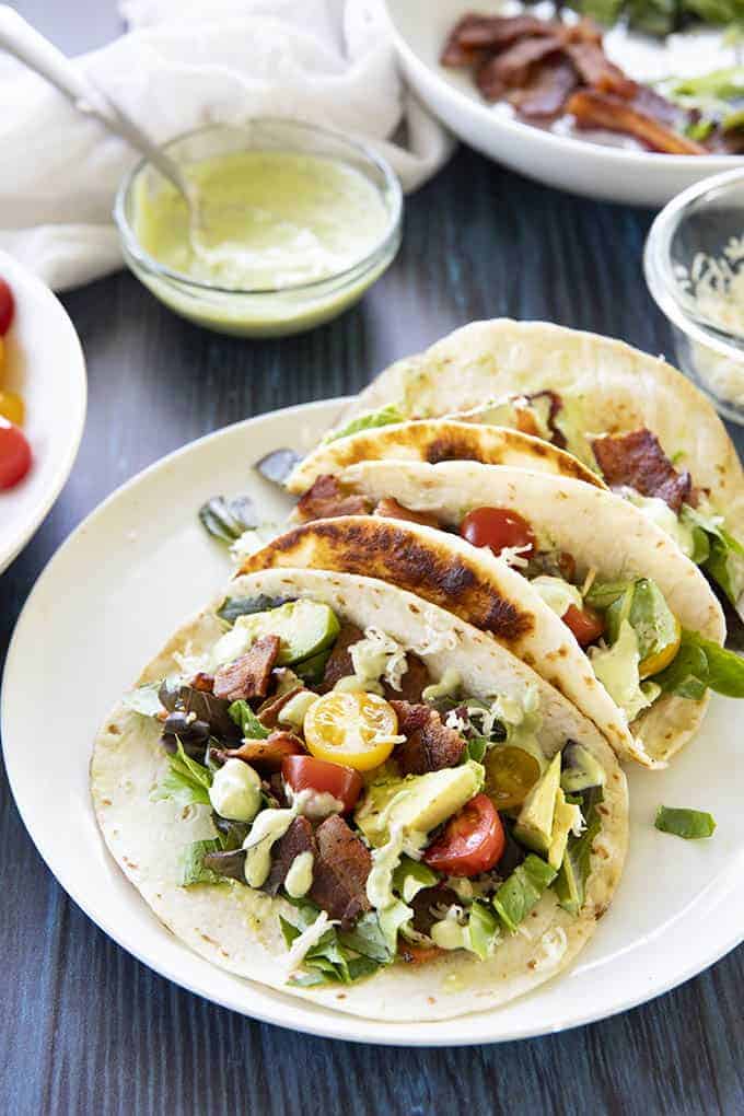 three blt tacos on a white plate