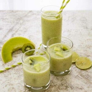 kiwi melon smoothie in three glasses
