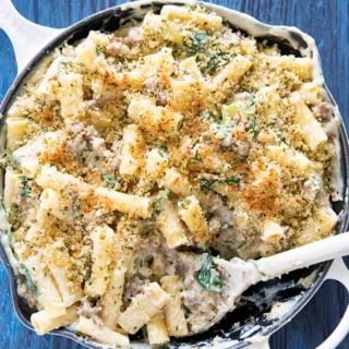 three cheese rigatoni in pan with a spoon