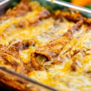 Baked Red Cheese Enchiladas in a glass dish
