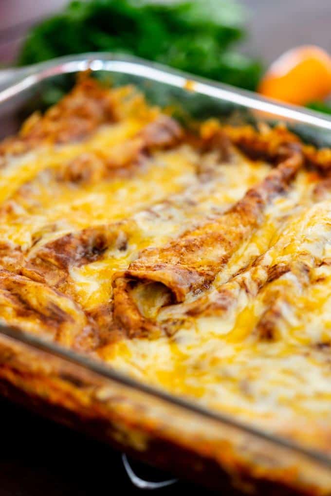 Baked Red Cheese Enchiladas in a glass dish