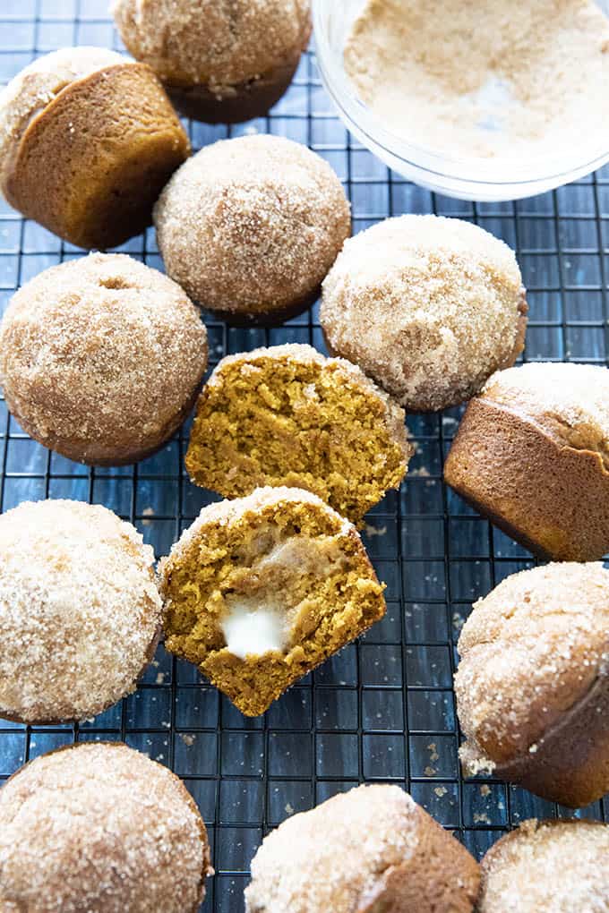 cinnamon sugar pumpkin muffins with butter on rack