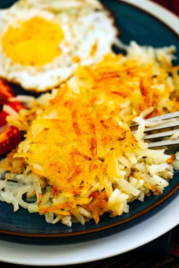 homemade hashbrowns on a blue plate 