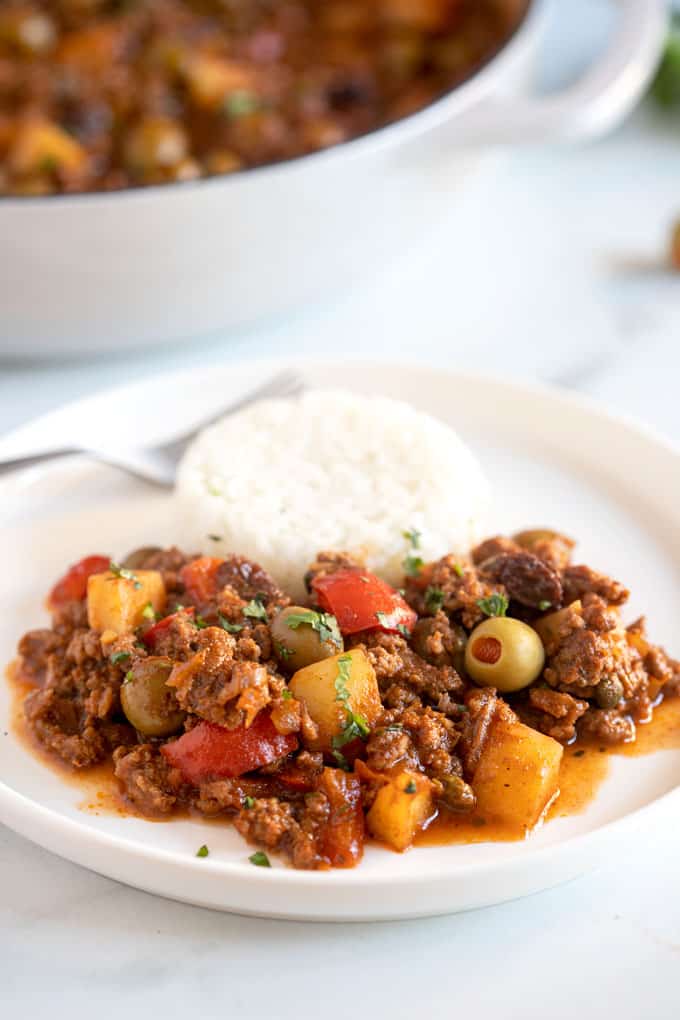 A plate of picadillo served with white rice