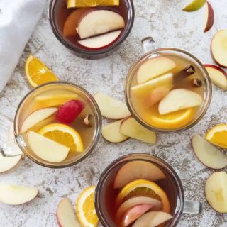 apple cider cocktail in four glasses