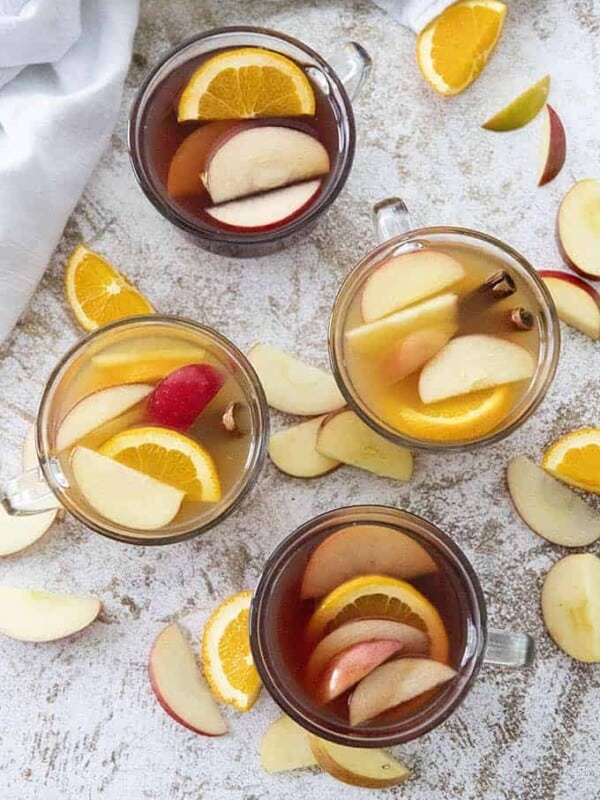 apple cider cocktail in four glasses