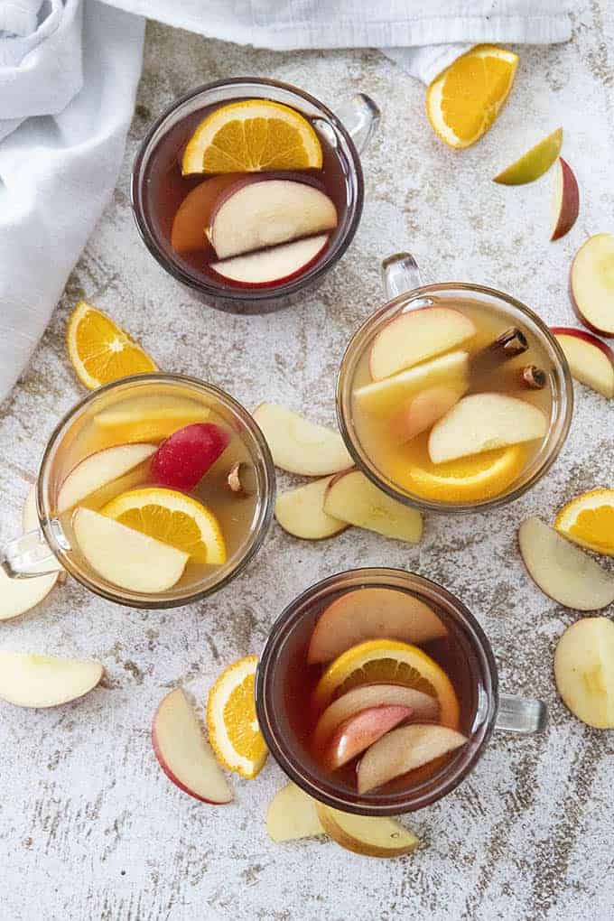 apple cider cocktail in four glasses