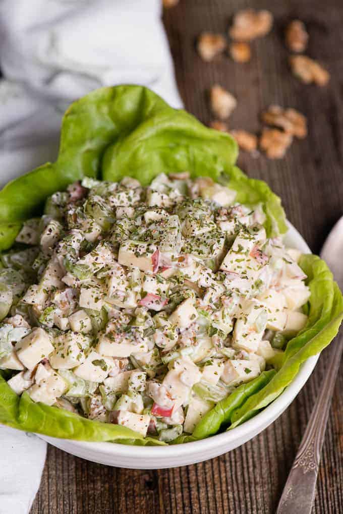 bowl of waldorf salad on lettuce in bowl