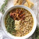 white bean soup with bacon in bowl