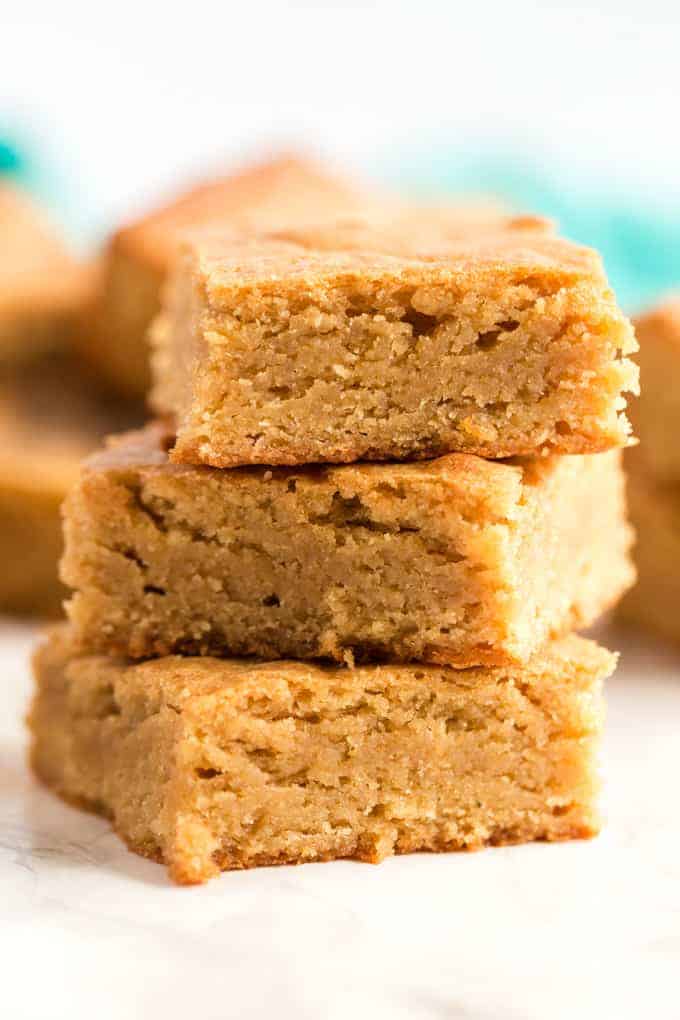 Blondies in a stack on a white background