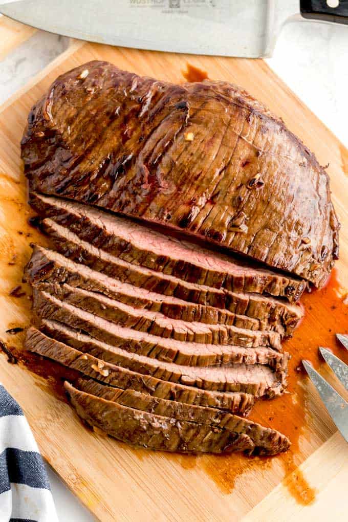 Sliced London broil on a cutting board