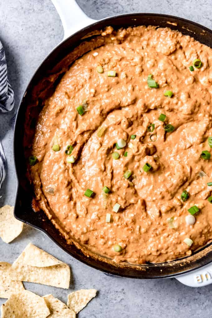 An image of homemade bean dip in a cast iron skillet.