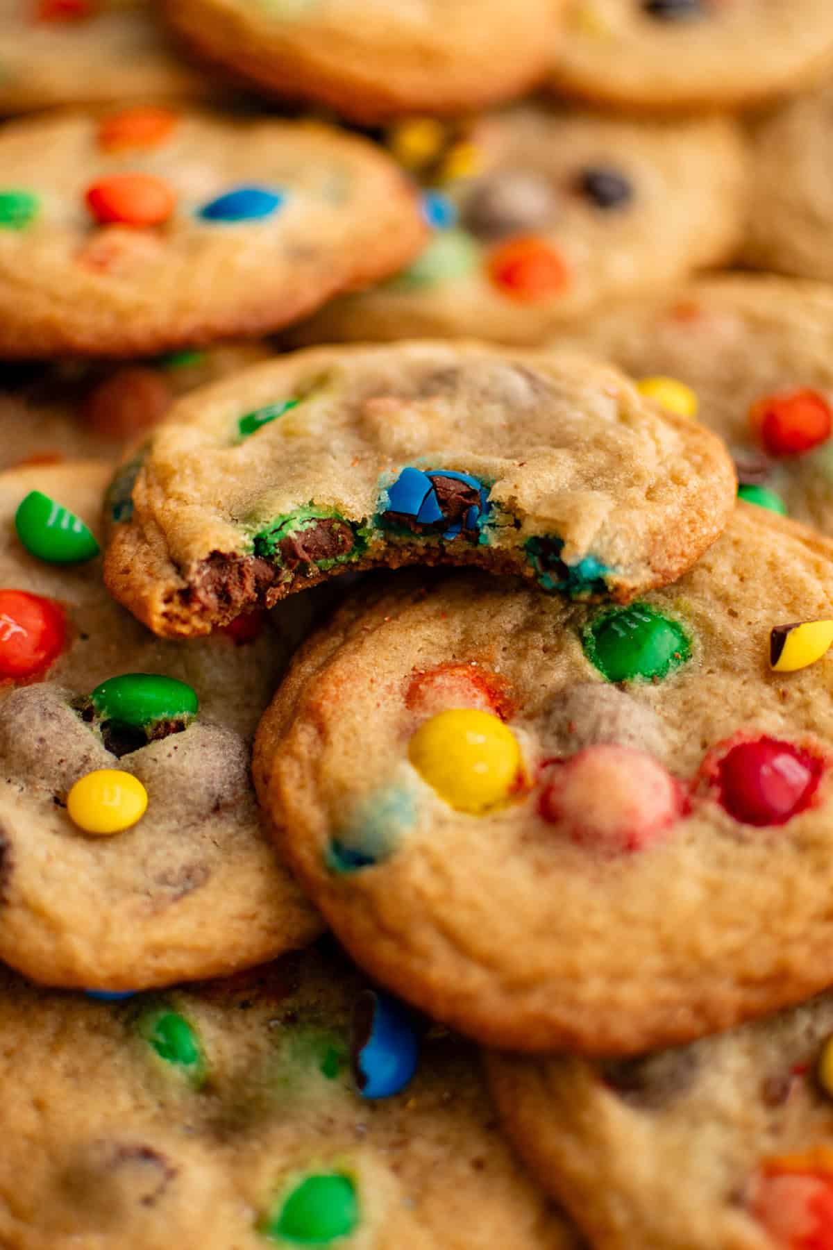 m&m cookies with a bite taken out of one