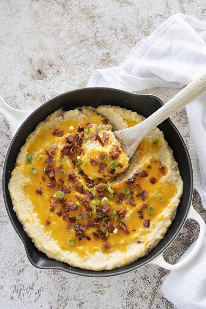 cauliflower casserole in dish with spoon