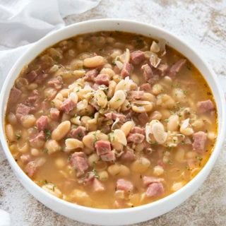 ham and bean soup in a white bowl