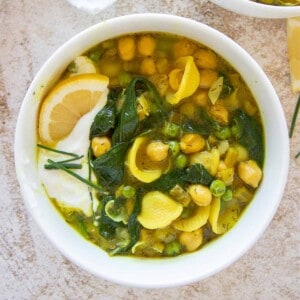 spring chickpea soup in a white bowl
