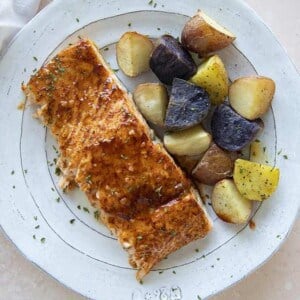 maple salmon on a plate with potatoes