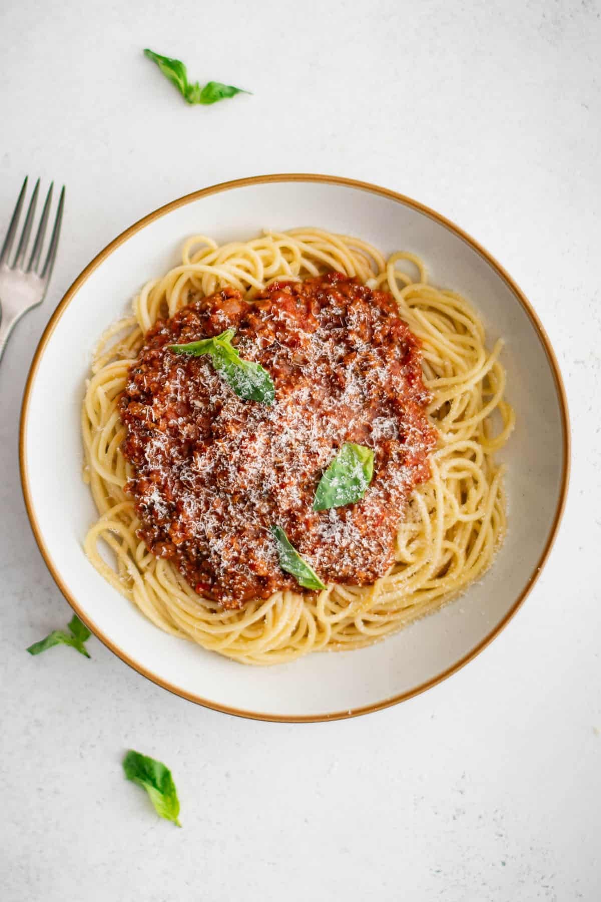 crockpot spaghetti sauce over a plate of spaghetti noodles
