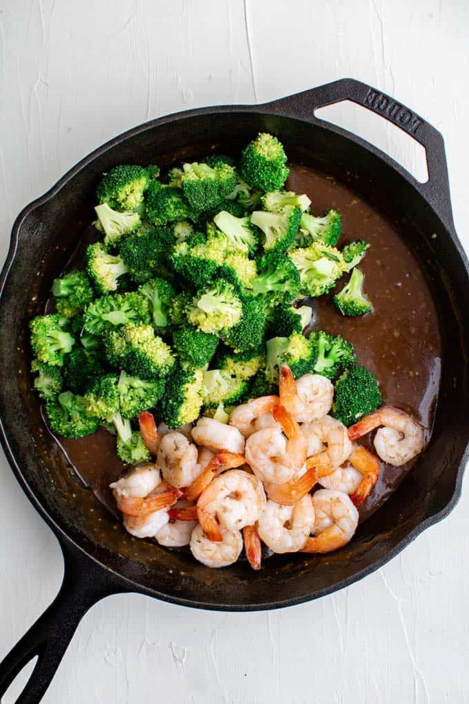 shrimp and broccoli stir fry ingredients in a pan