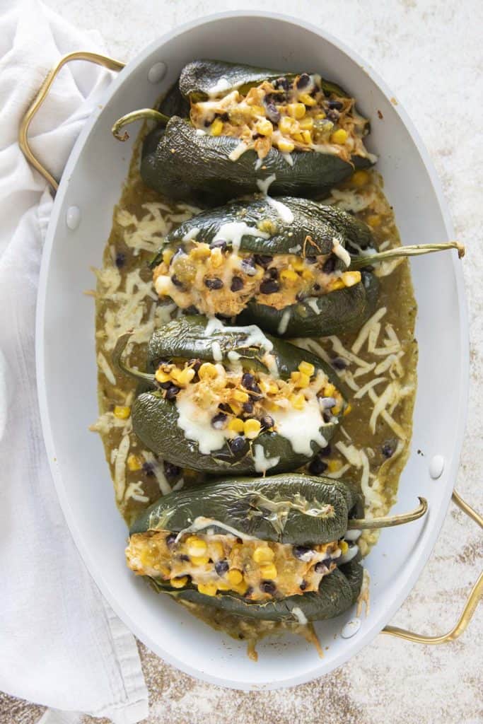 stuffed poblano peppers in a baking dish