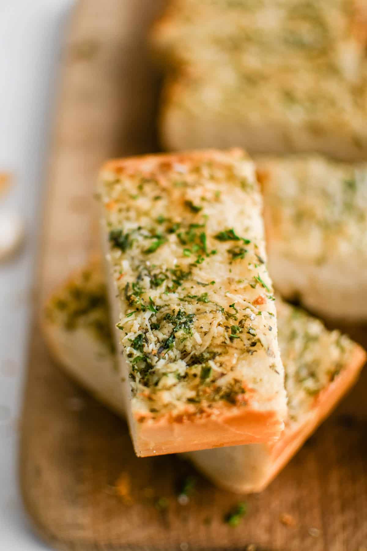 close up image of a piece of garlic bread