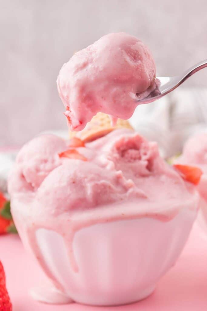 strawberry ice cream in a white bowl