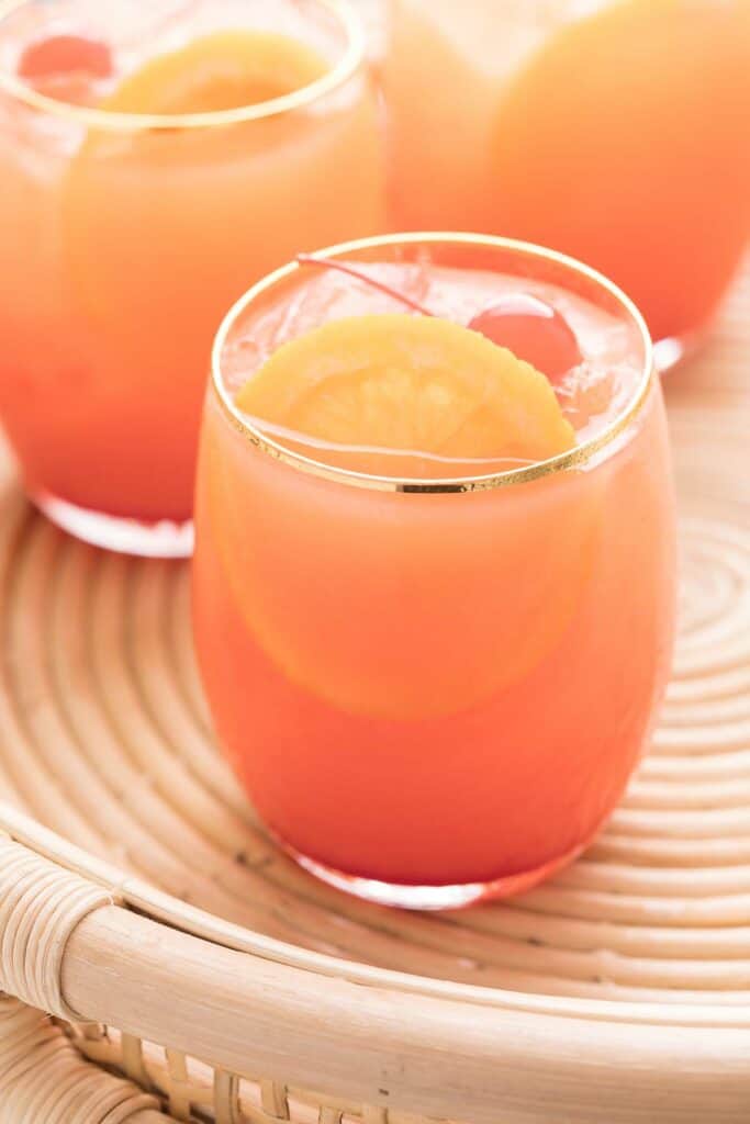 three glasses of tequila sunrise cocktail mixed up