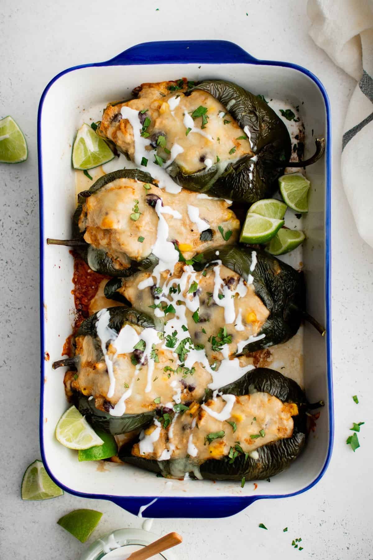 stuffed poblano peppers in a baking dish