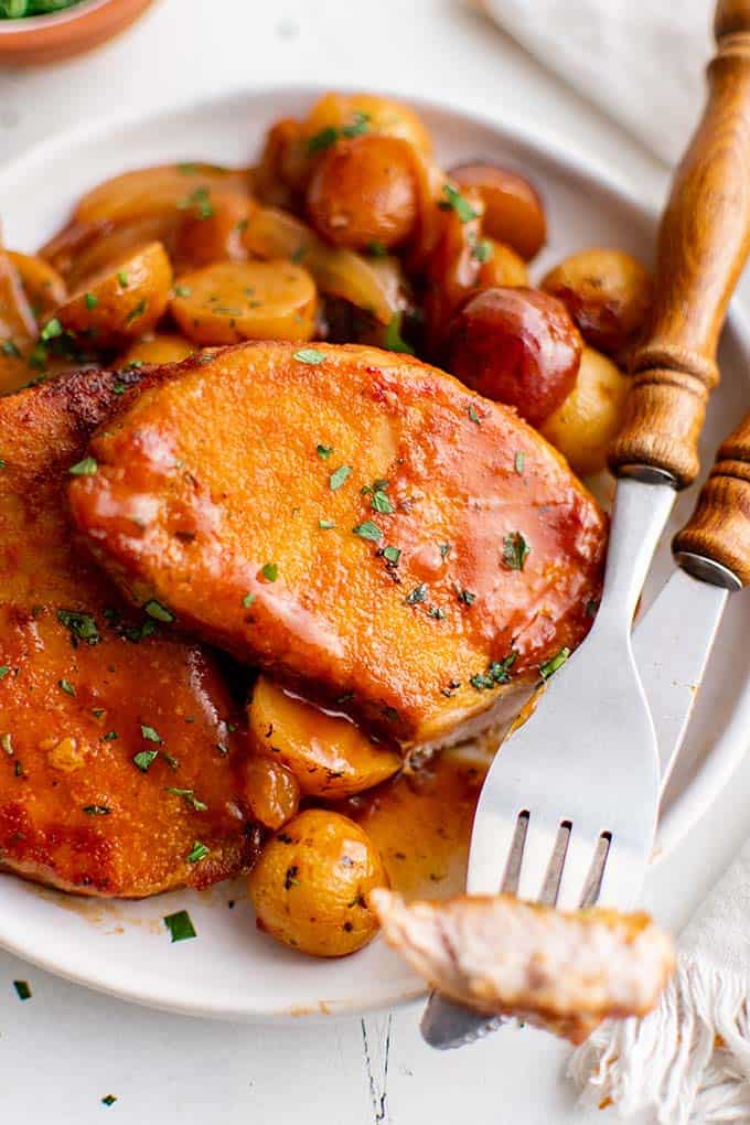 bbq pork chops on a plate with potatoes