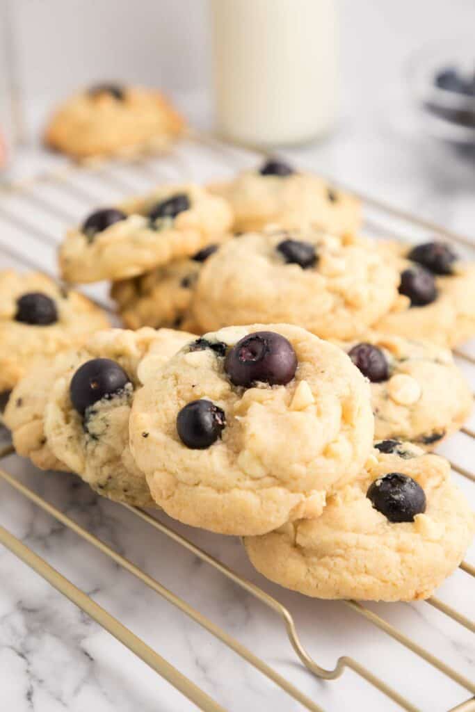 white chocolate blueberry cookies on a wire rack