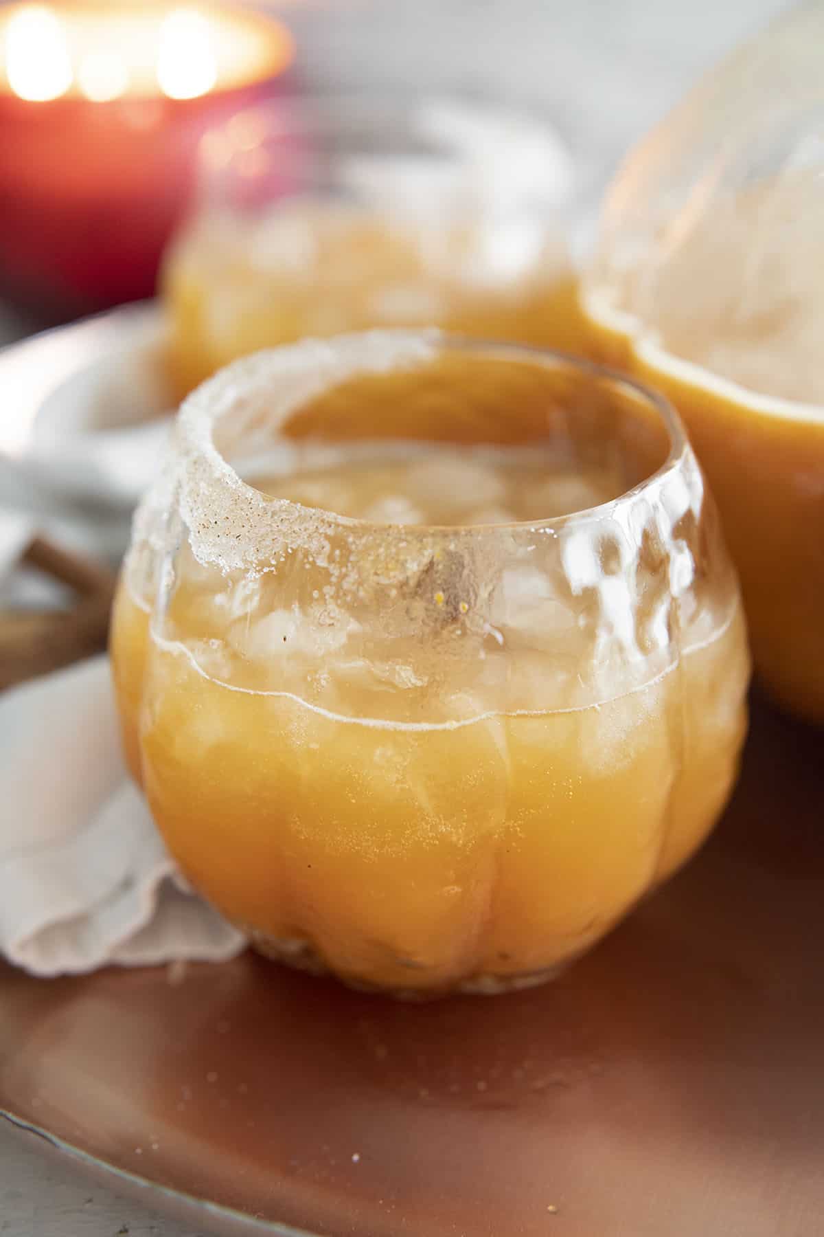 pumpkin margarita in a glass with cinnamon sugar rim