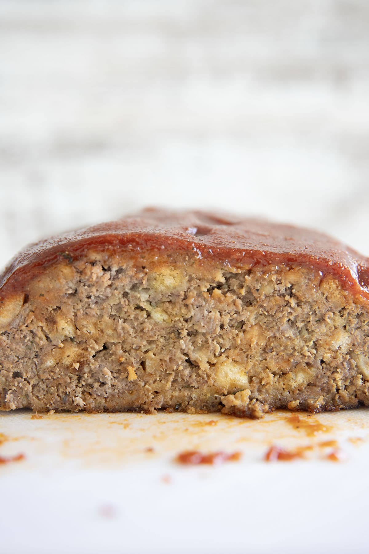 close up photo of meatloaf on a cutting board