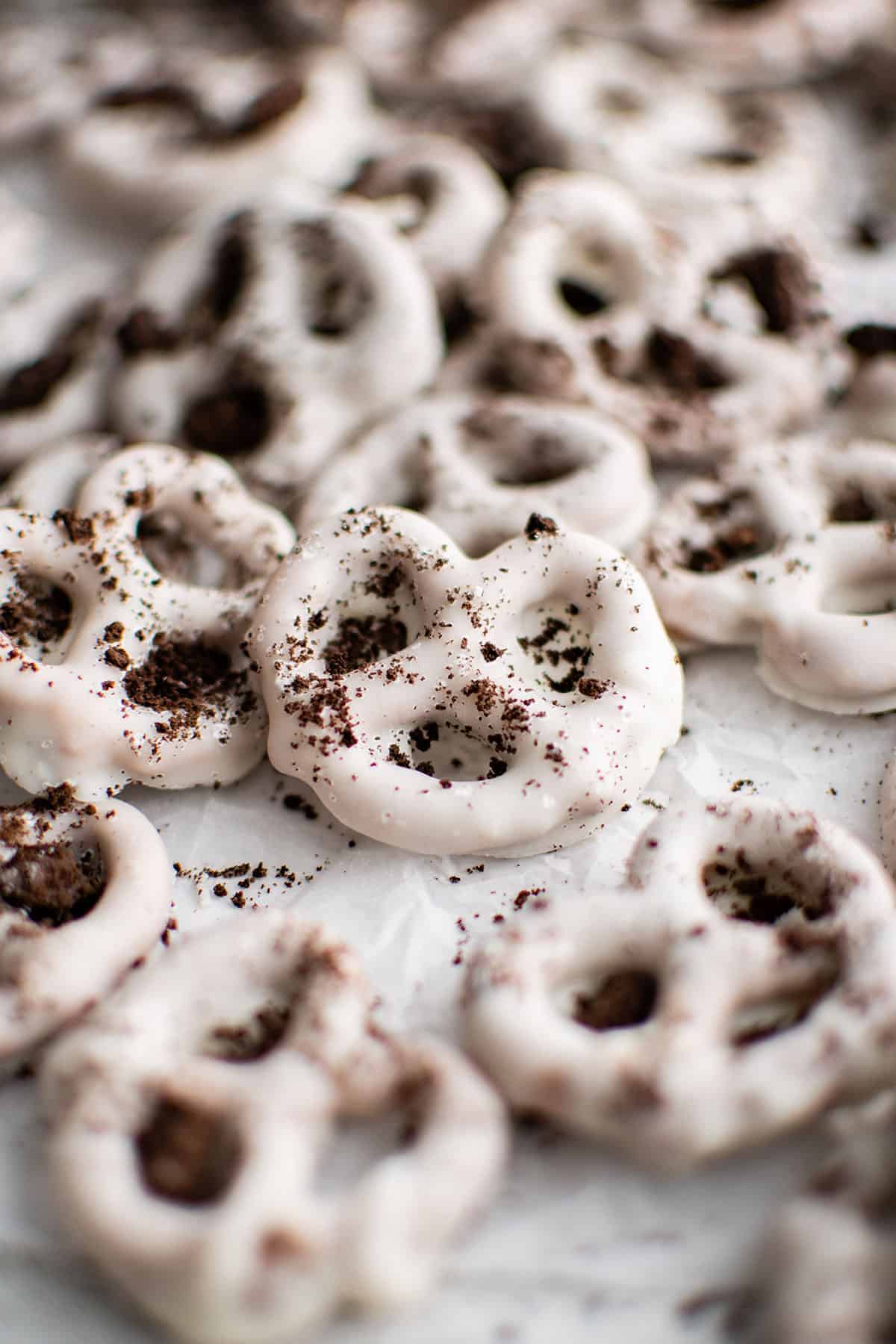 pretzels with white chocolate coating and oreo crumbs