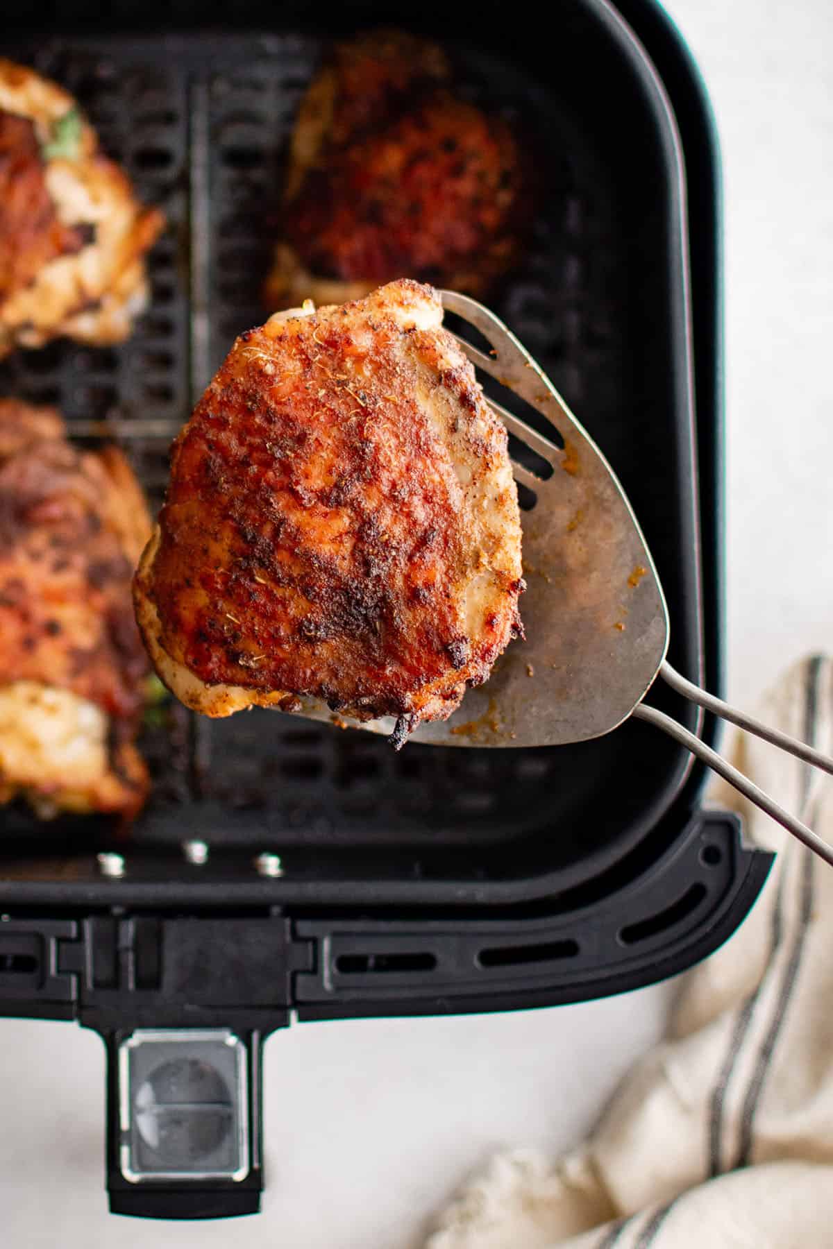 air fryer chicken thigh on a spatula